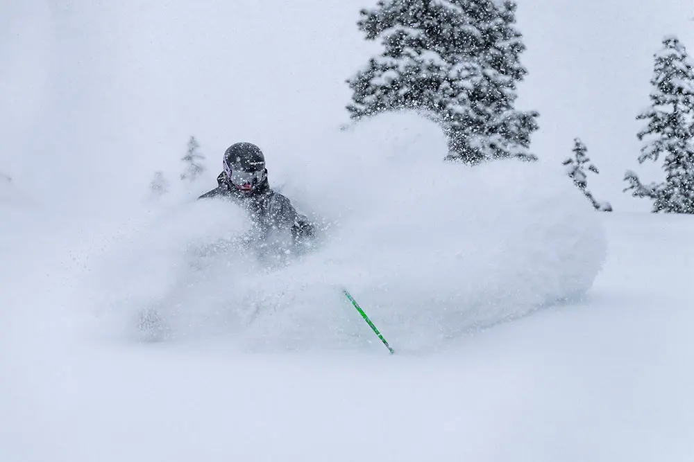 Skier in deep powder at Snowbird who booked with the 5th night free lodging special