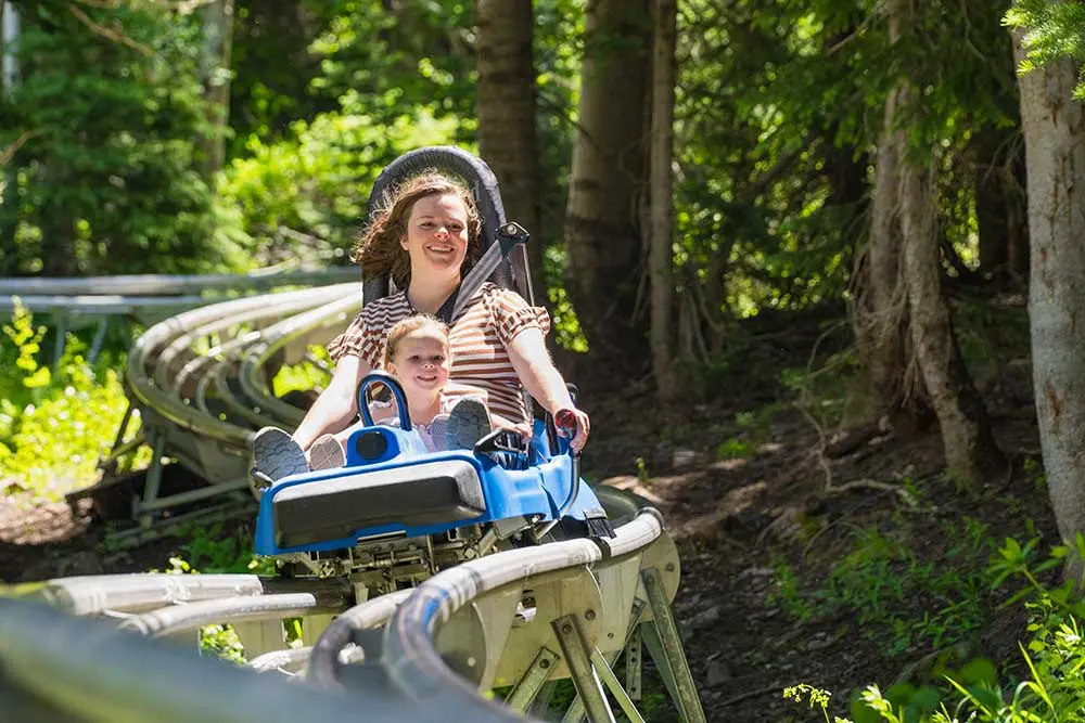 Family staying at the Iron Blosam rides the Mountain Coaster with stay & save deals