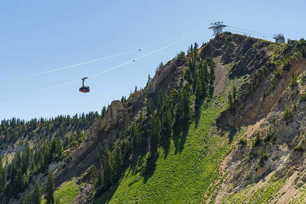 Summer Tram rises to Snowbird's Hidden Peak, tram rides are available at a discount for lodging guests