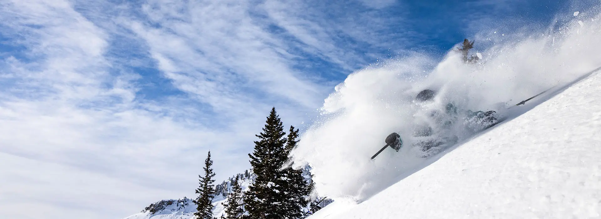 Skier in overhead powder in Mineral Basin at Snowbird with a winter lift ticket