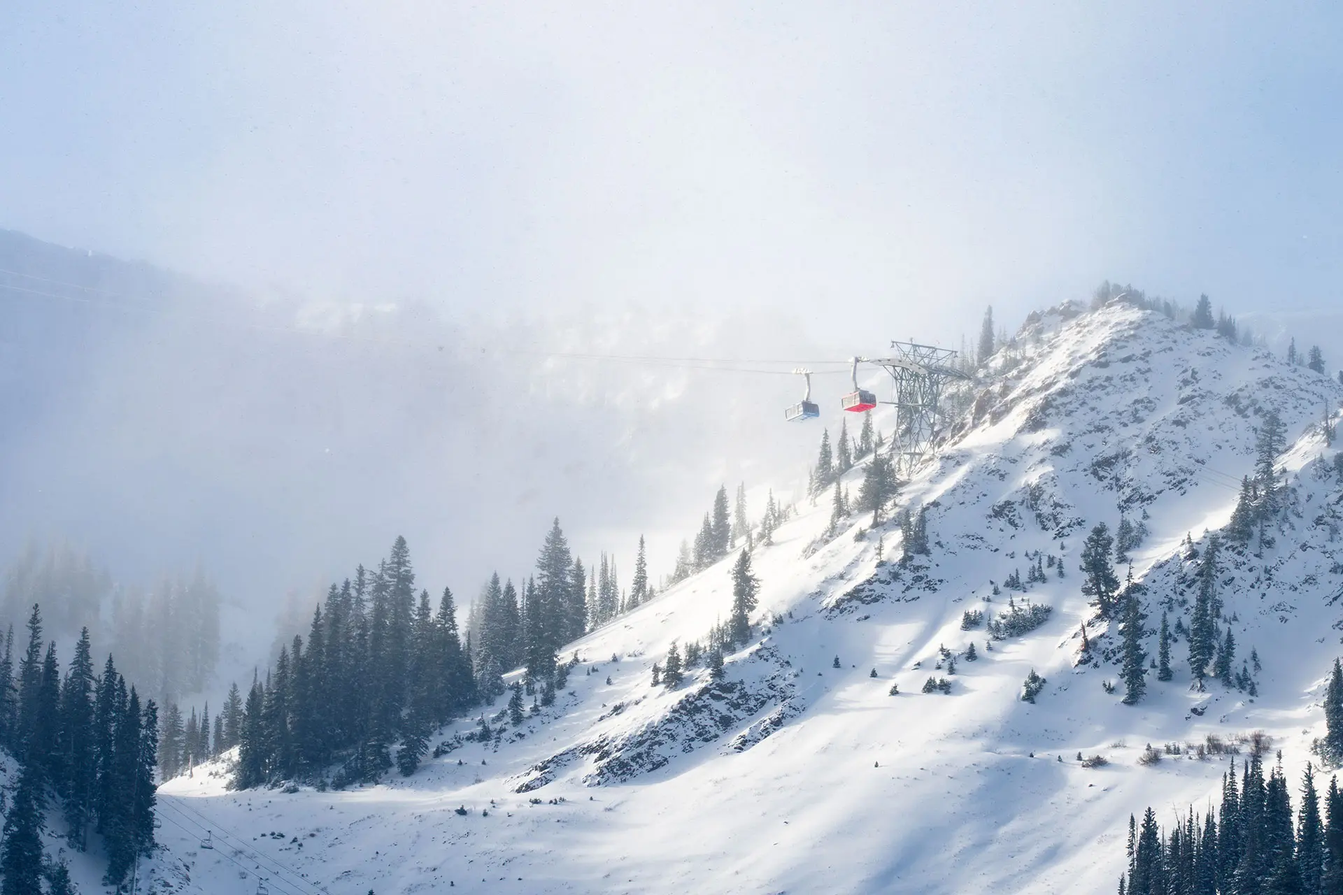 Red and blue tram early season at Snowbird before opening day