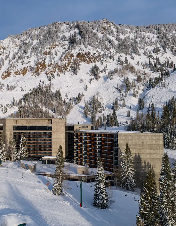 The Cliff Lodge at Snowbird with the mountain in the background- mobile hero