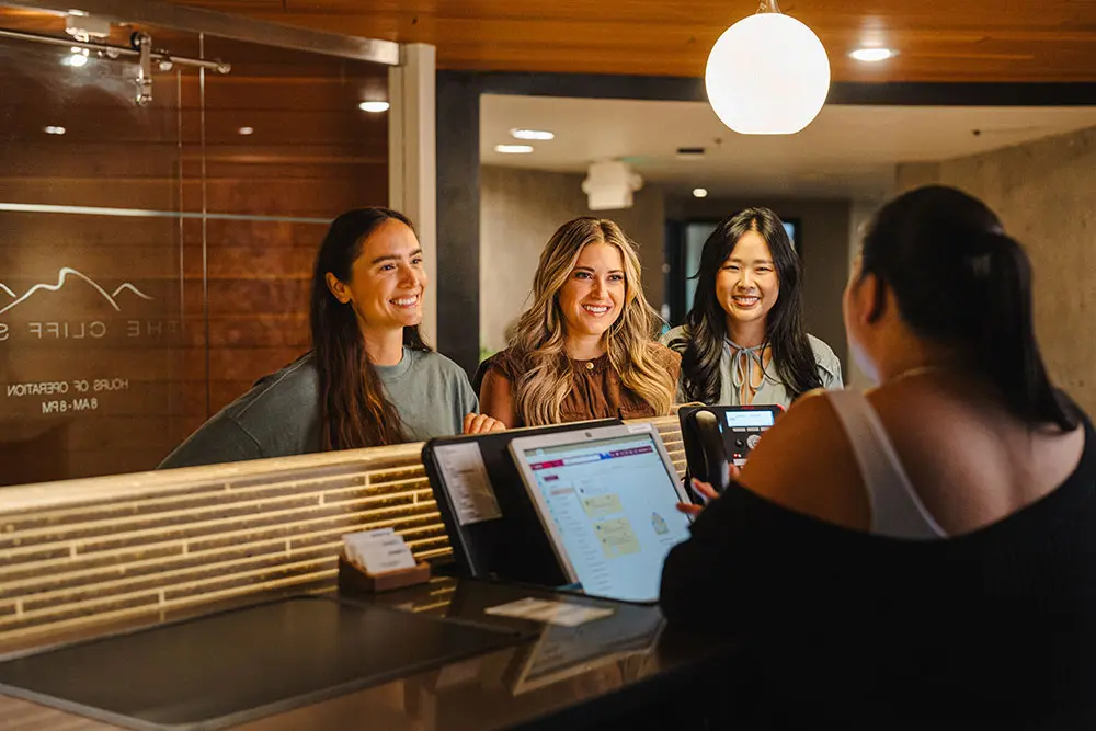 People check in at the cliff spa with the front guest attendent